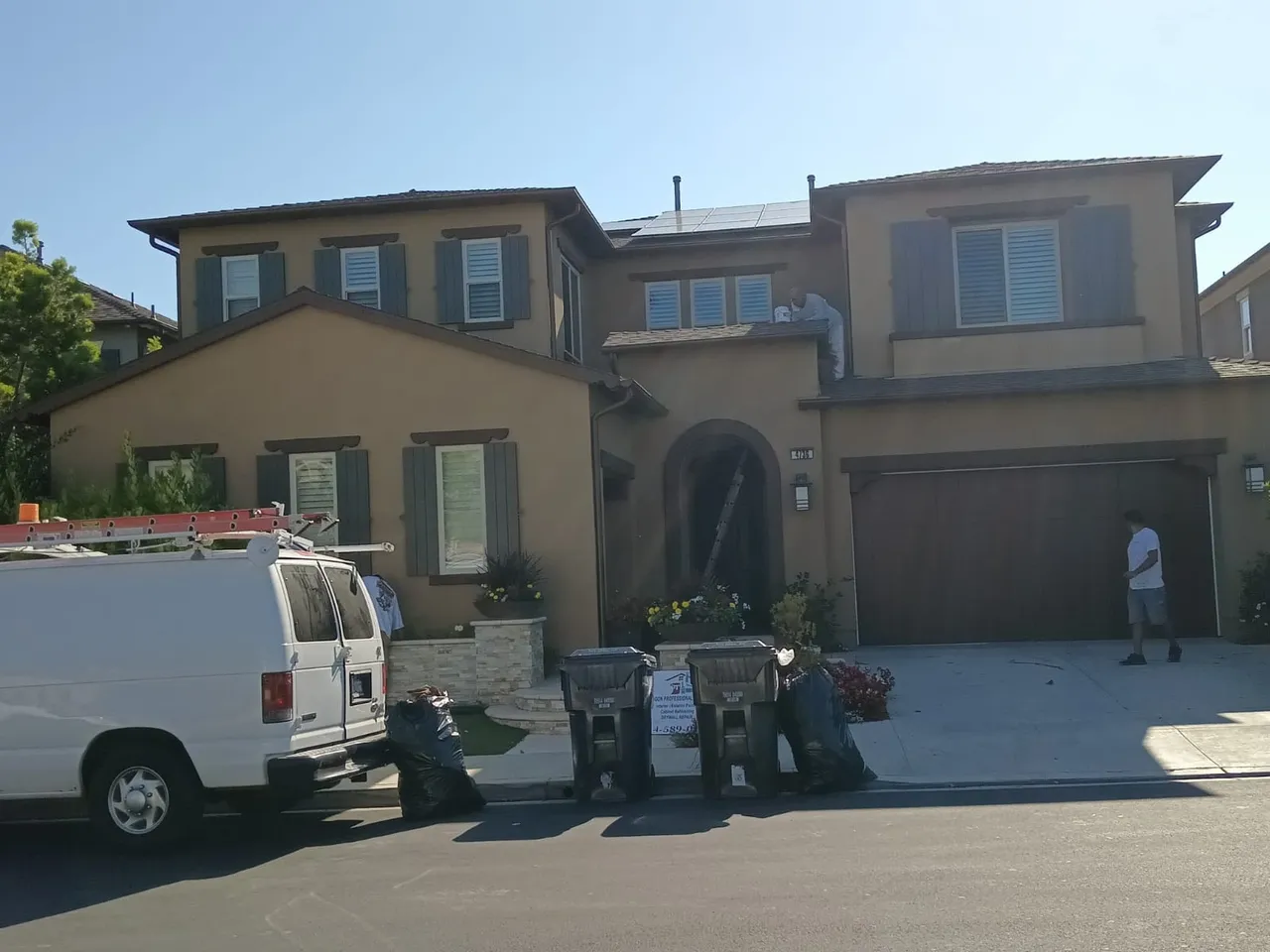 Aragon Professional Painting crew repainting a two-story stucco home exterior in south Orange County